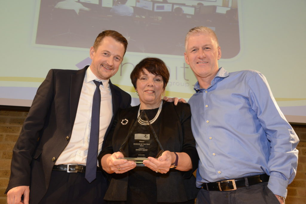 Three People With Award | Infinity Group